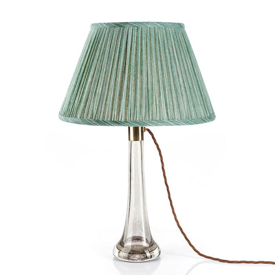 Fermoie Green Strie lampshade on a glass lamp