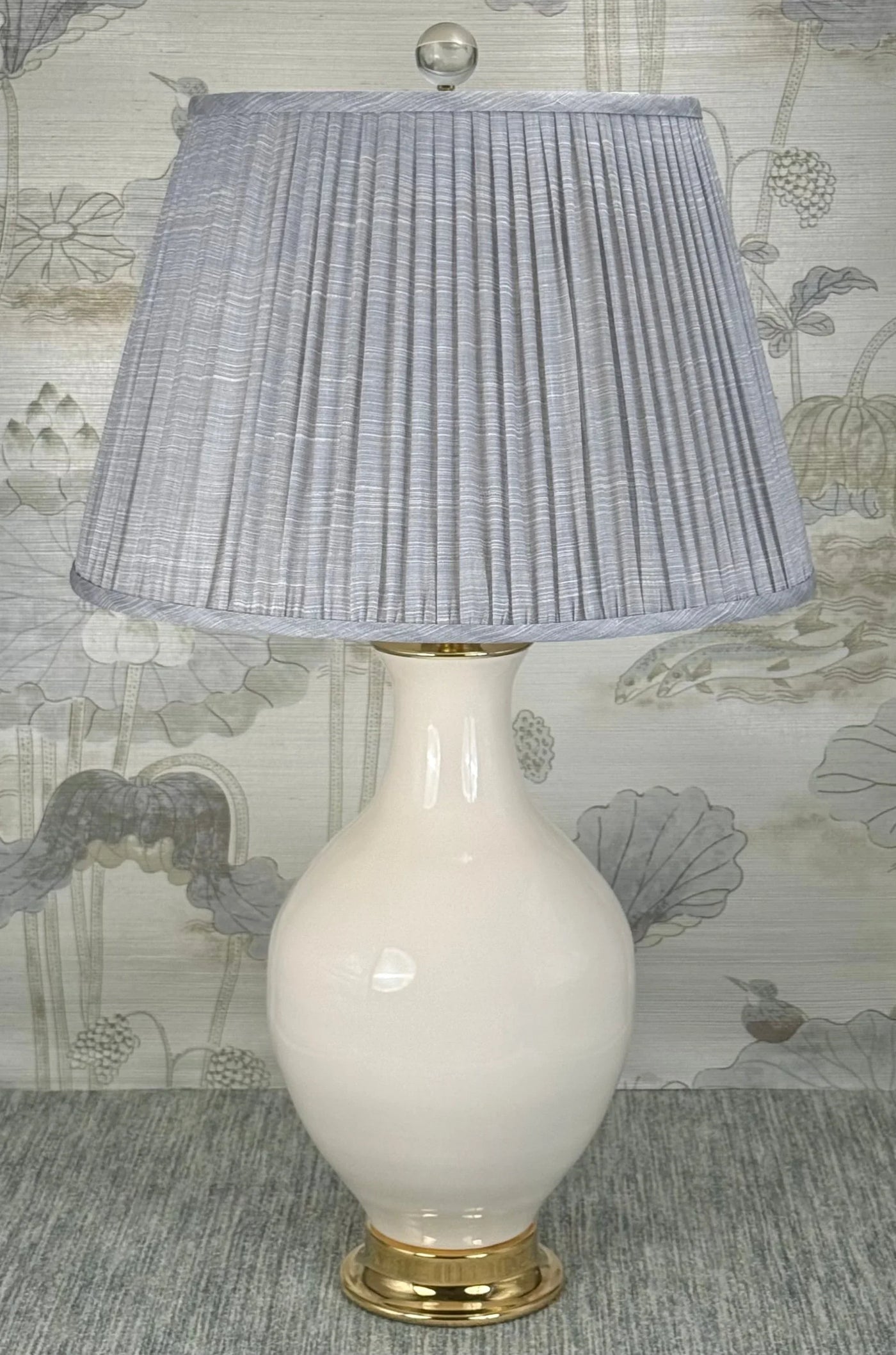 Large Clear Crystal Ball Finial in Polished Brass styled with a Fermoie strie lampshade on a Paul Schneider Athens ceramic lamp