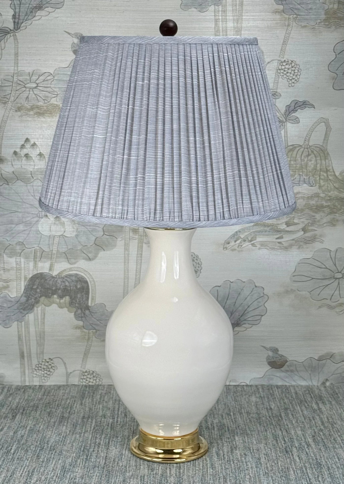 Mahogany Finish Wood Ball on Pedestal lamp finial styled with a Fermoie strie lampshade on a Paul Schneider Athens ceramic lamp