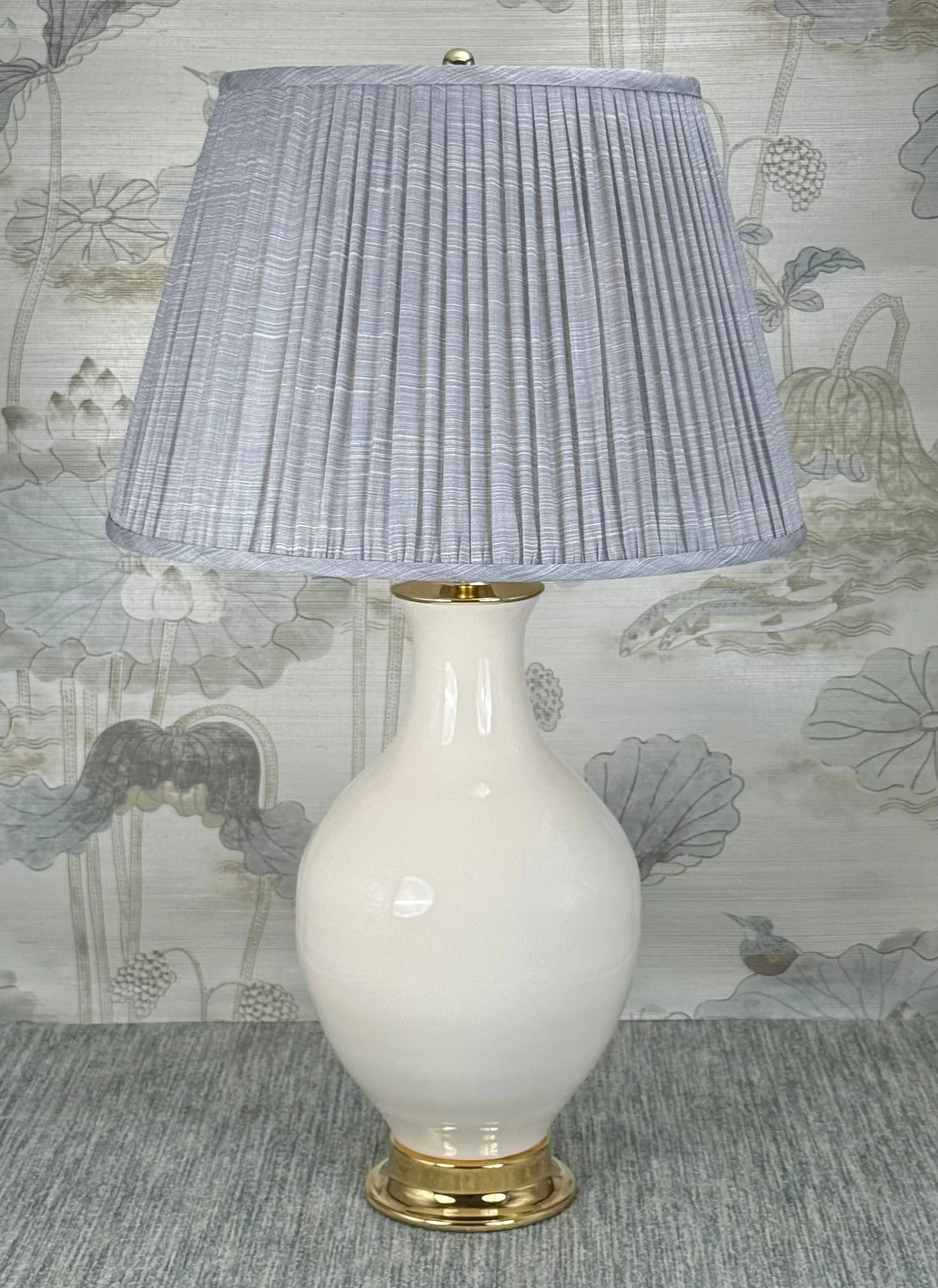 Mini Polished Brass Ball lamp finial styled with a Fermoie strie lampshade on a Paul Schneider Athens ceramic lamp