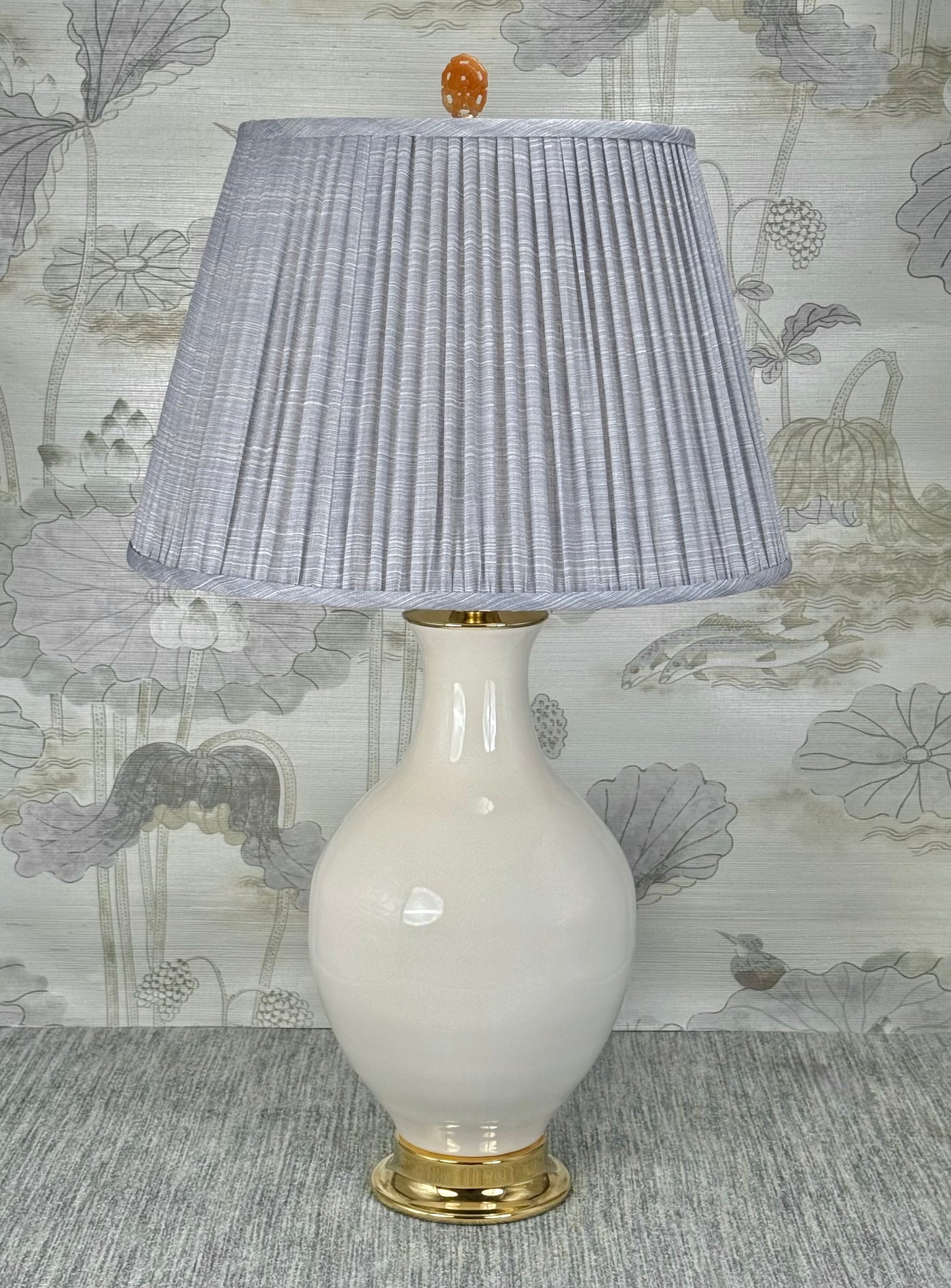 Orange Jasper Oval  lamp finial styled with a Fermoie strie lampshade on a Paul Schneider Athens ceramic lamp