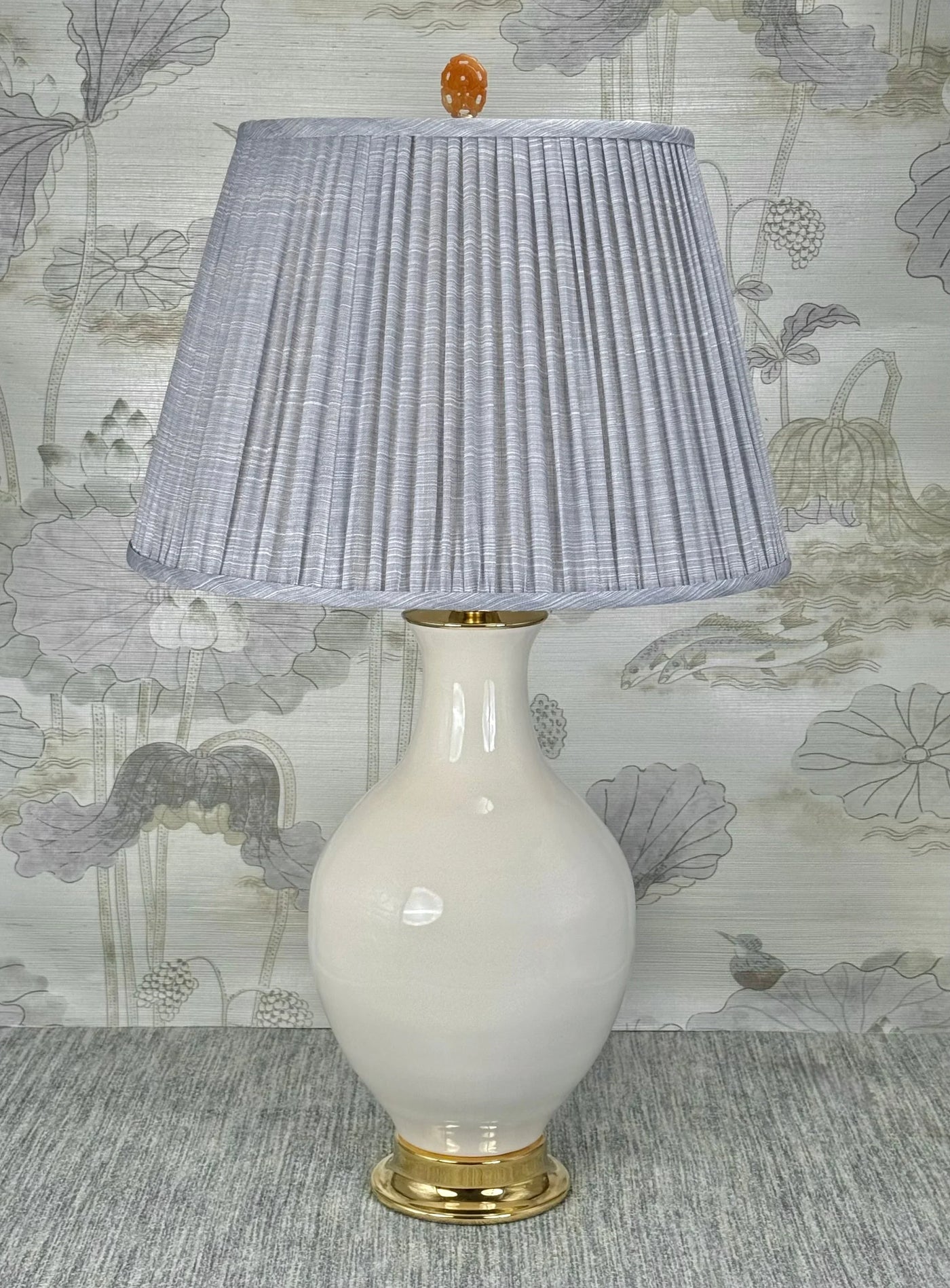 Orange Jasper Oval  lamp finial styled with a Fermoie strie lampshade on a Paul Schneider Athens ceramic lamp