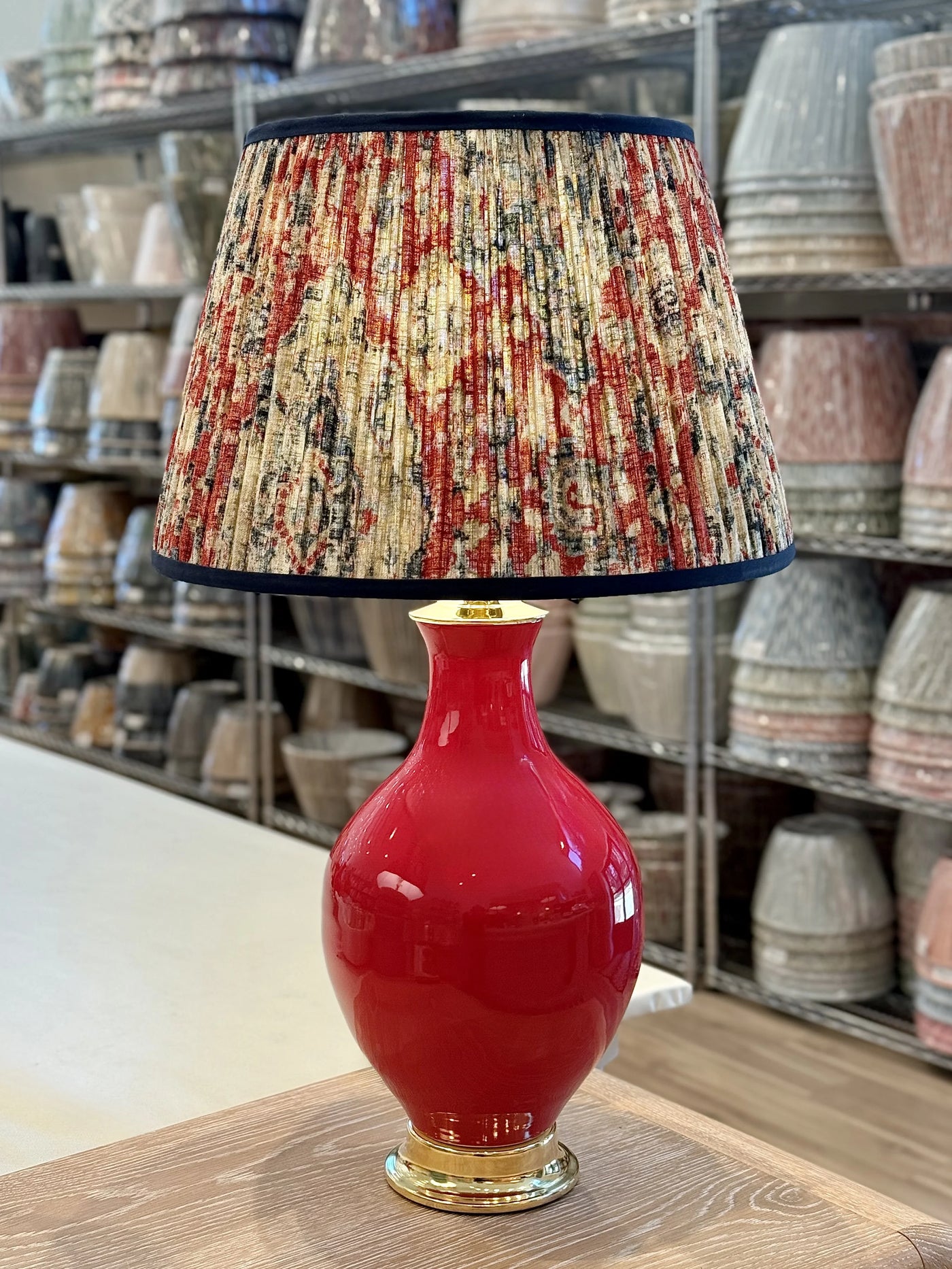Paul Schneider Athens Lamp in Glossy Fire Red paired with Red, Navy & Taupe Ikat Lampshade with Navy Trim