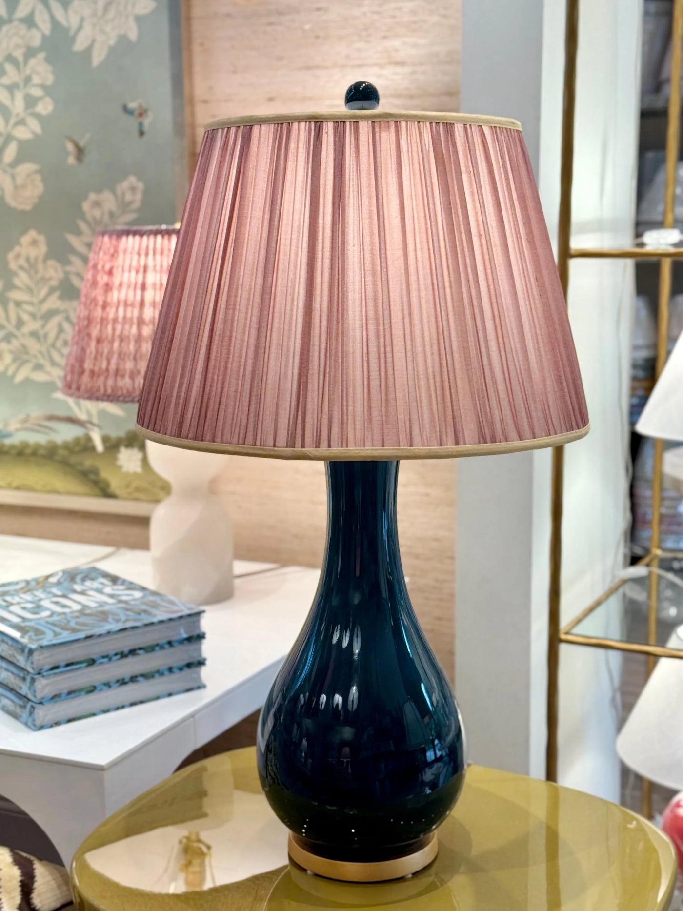 Pink sari lampshade with gold trim on navy porcelain lamp with gold leaf base