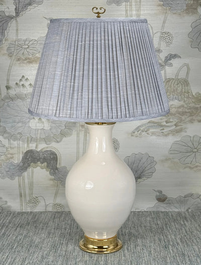 Polished Brass Open Loop lamp finial styled with a Fermoie strie lampshade on a Paul Schneider Athens ceramic lamp