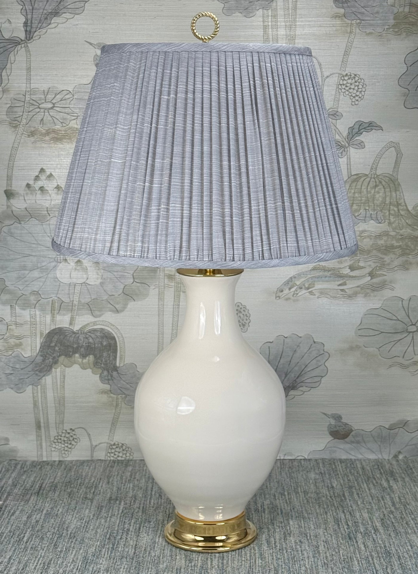 Polished Brass Ring lamp finial styled with a Fermoie strie lampshade on a Paul Schneider Athens ceramic lamp.