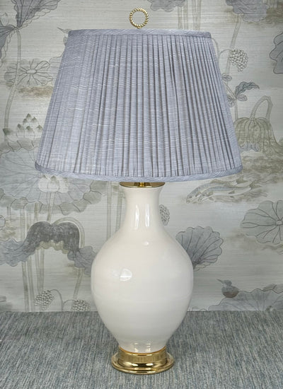 Polished Brass Ring lamp finial styled with a Fermoie strie lampshade on a Paul Schneider Athens ceramic lamp.