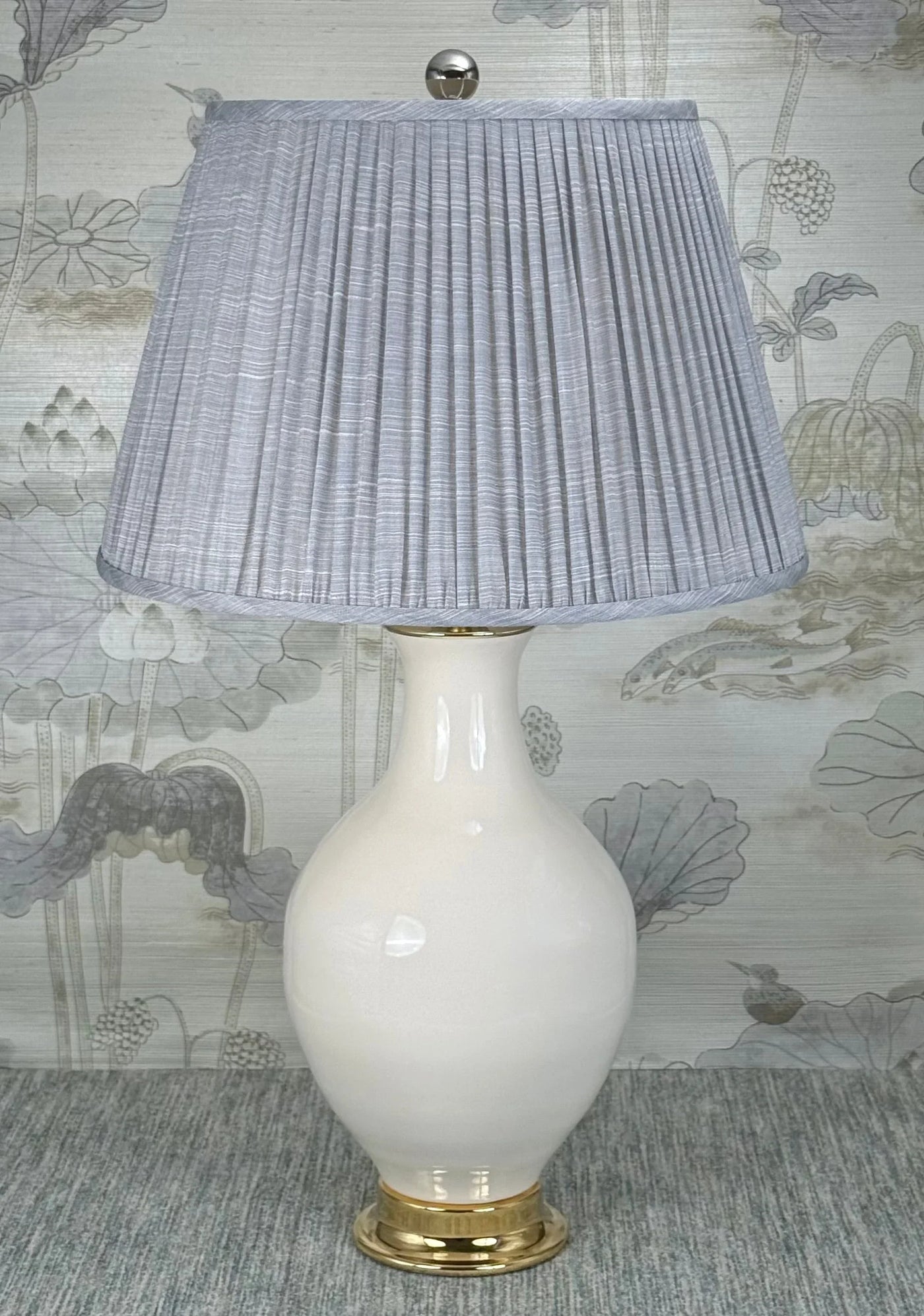 Polished Nickel Ball lamp finial styled with a Fermoie strie lampshade on a Paul Schneider Athens ceramic lamp