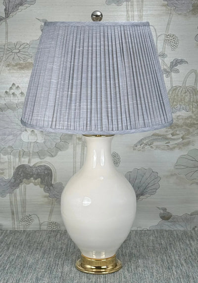 Polished Nickel Ball lamp finial styled with a Fermoie strie lampshade on a Paul Schneider Athens ceramic lamp