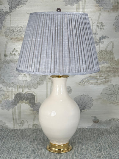 Polished Stone Ring lamp finial styled with a Fermoie strie lampshade on a Paul Schneider Athens ceramic lamp
