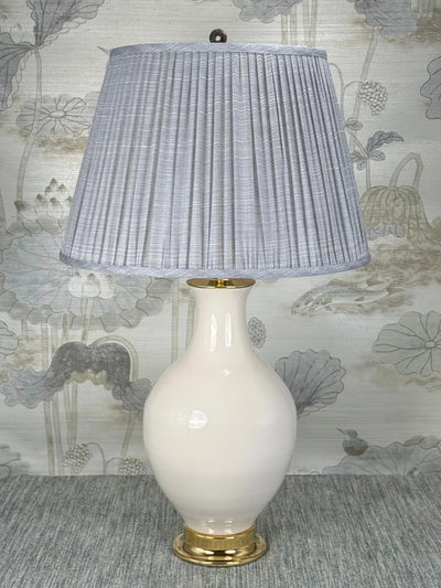 Polished Stone Ring lamp finial styled with a Fermoie strie lampshade on a Paul Schneider Athens ceramic lamp
