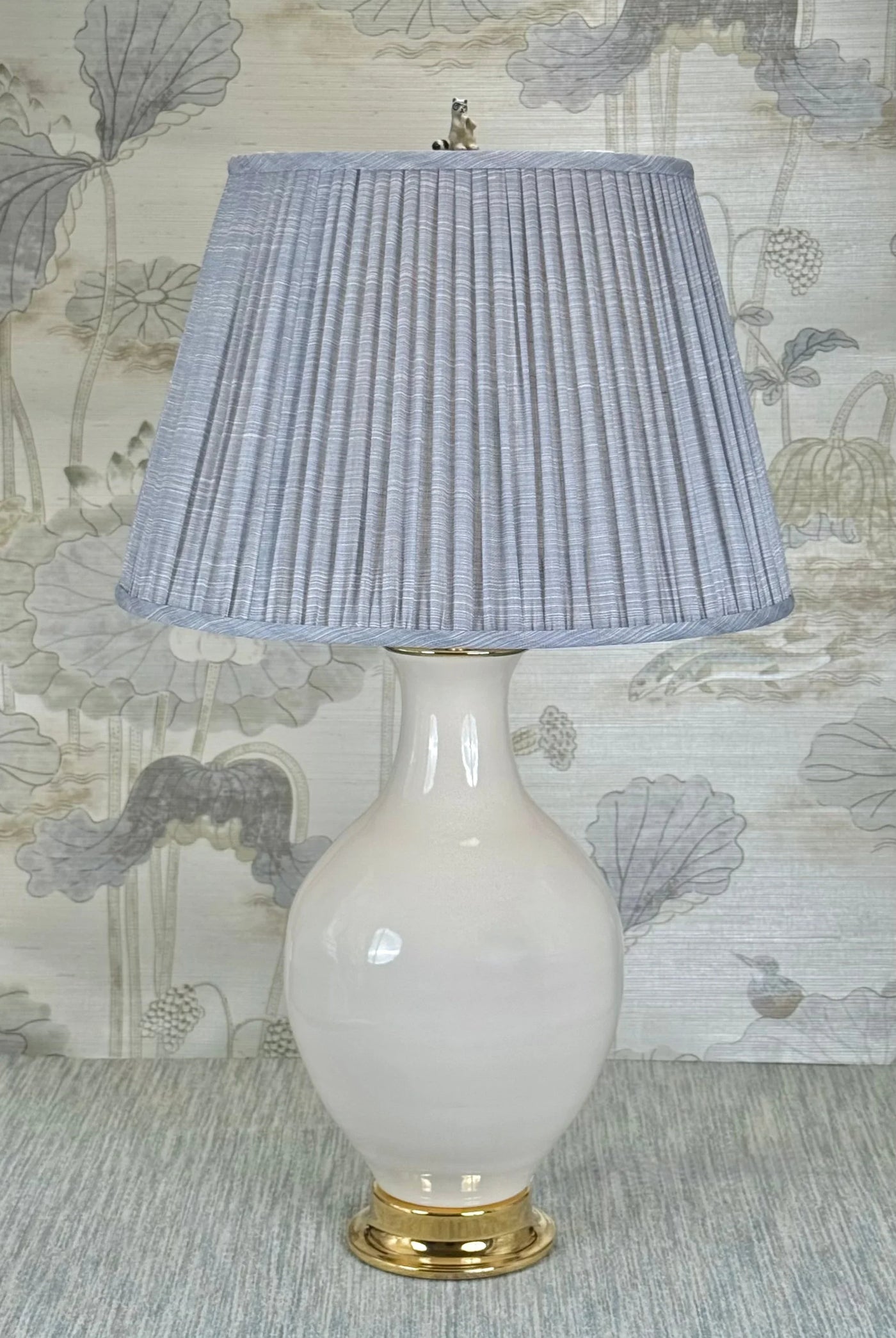 Raccoon Finial lamp finial styled with a Fermoie strie lampshade on a Paul Schneider Athens ceramic lamp