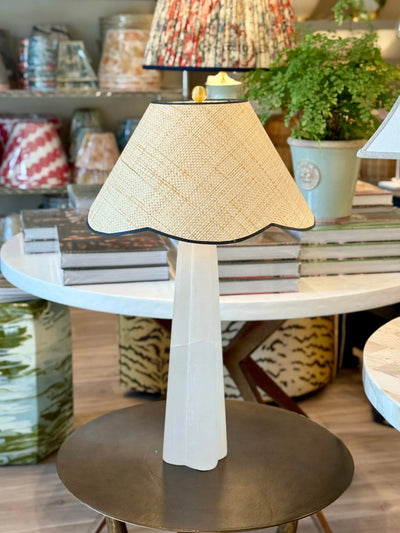 Raffia Scalloped Flare Lampshade with Navy Trim on alabaster lamp