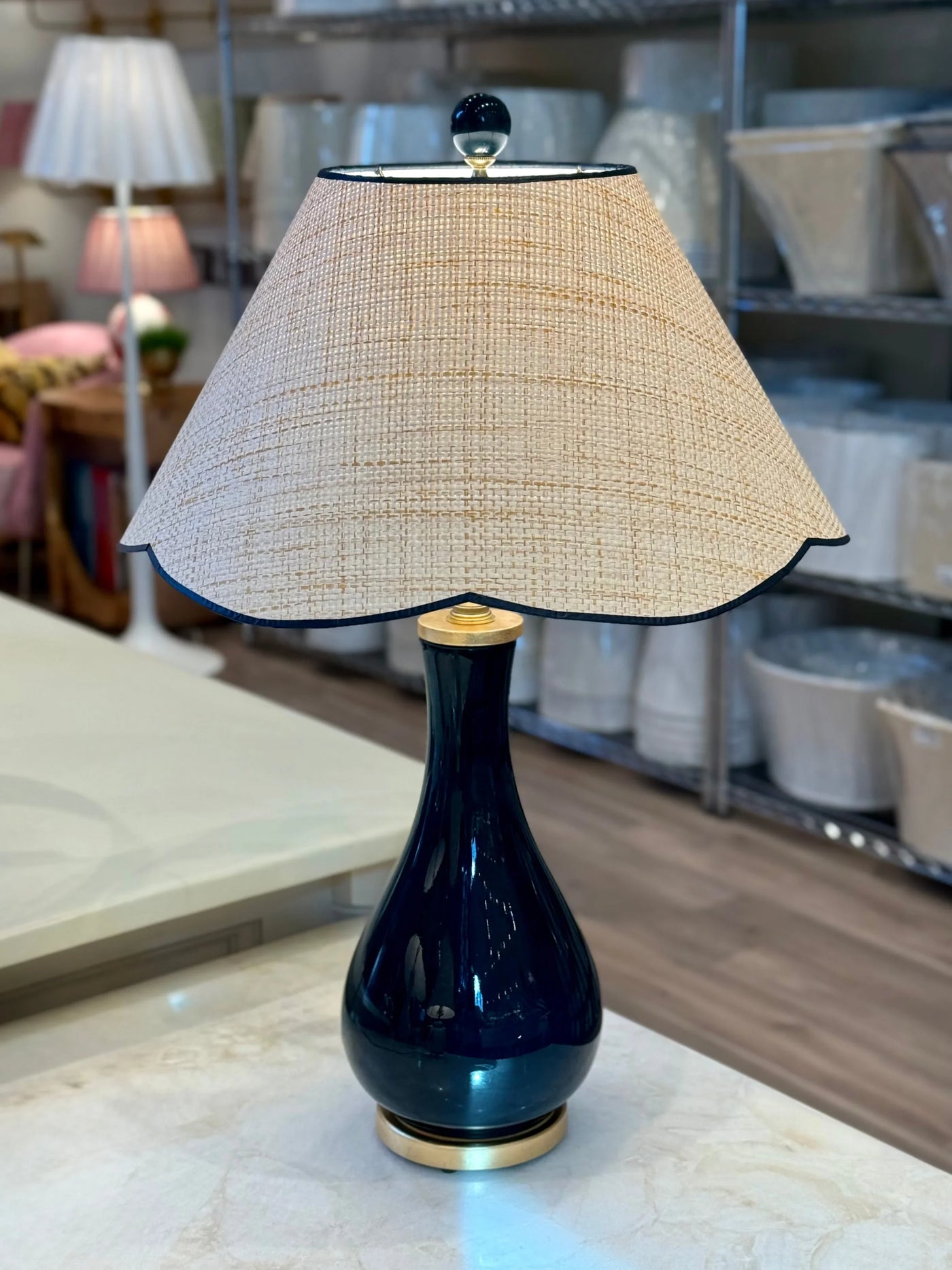 Raffia Scalloped Flare Lampshade with Navy Trim on navy porcelain lamp