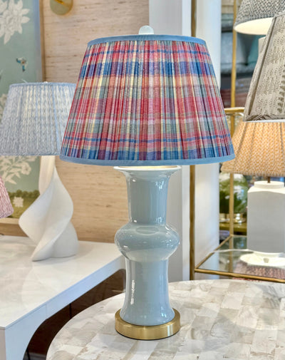Vignette Red, Blue, Yellow & Green Plaid Lampshade with Grosgrain Trim on light blue lamp with gold base