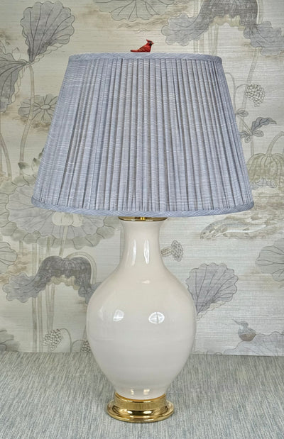 red cardinal lamp finial styled with a Fermoie strie lampshade on a Paul Schneider Athens ceramic lamp.