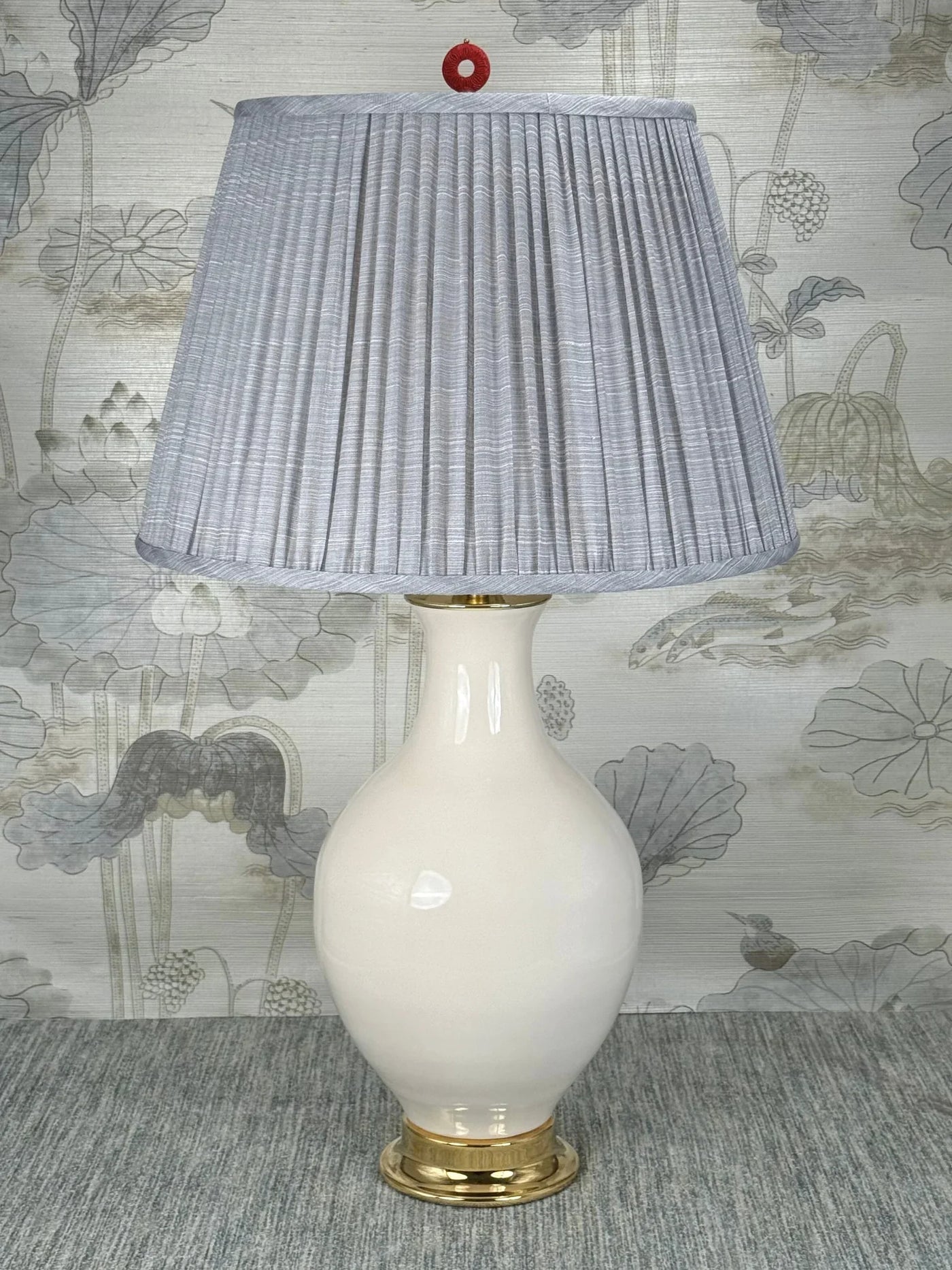 Red Cinnabar Ring lamp finial styled with a Fermoie strie lampshade on a Paul Schneider Athens ceramic lamp