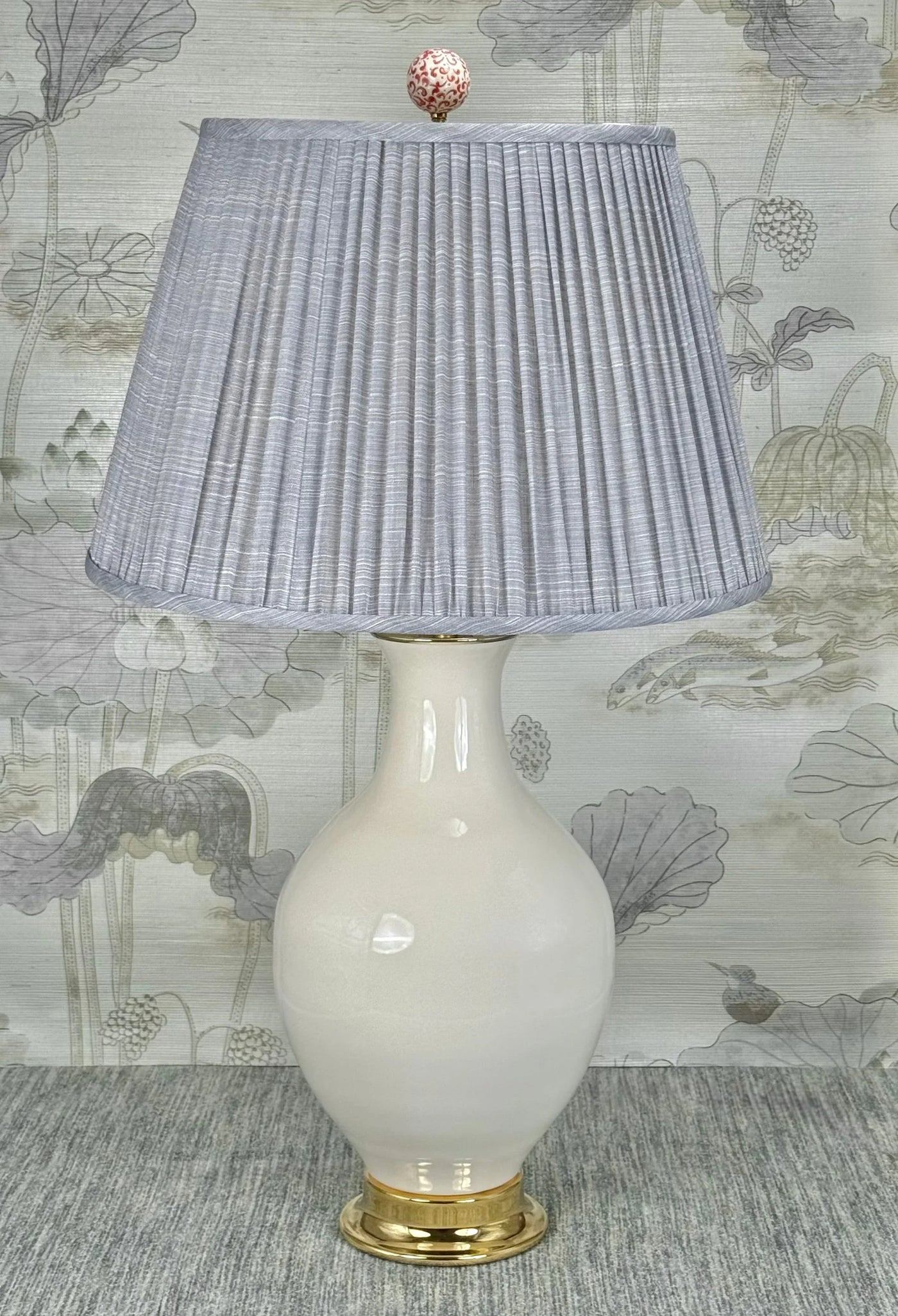 Red on White Porcelain lamp finial styled with a Fermoie strie lampshade on a Paul Schneider Athens ceramic lamp