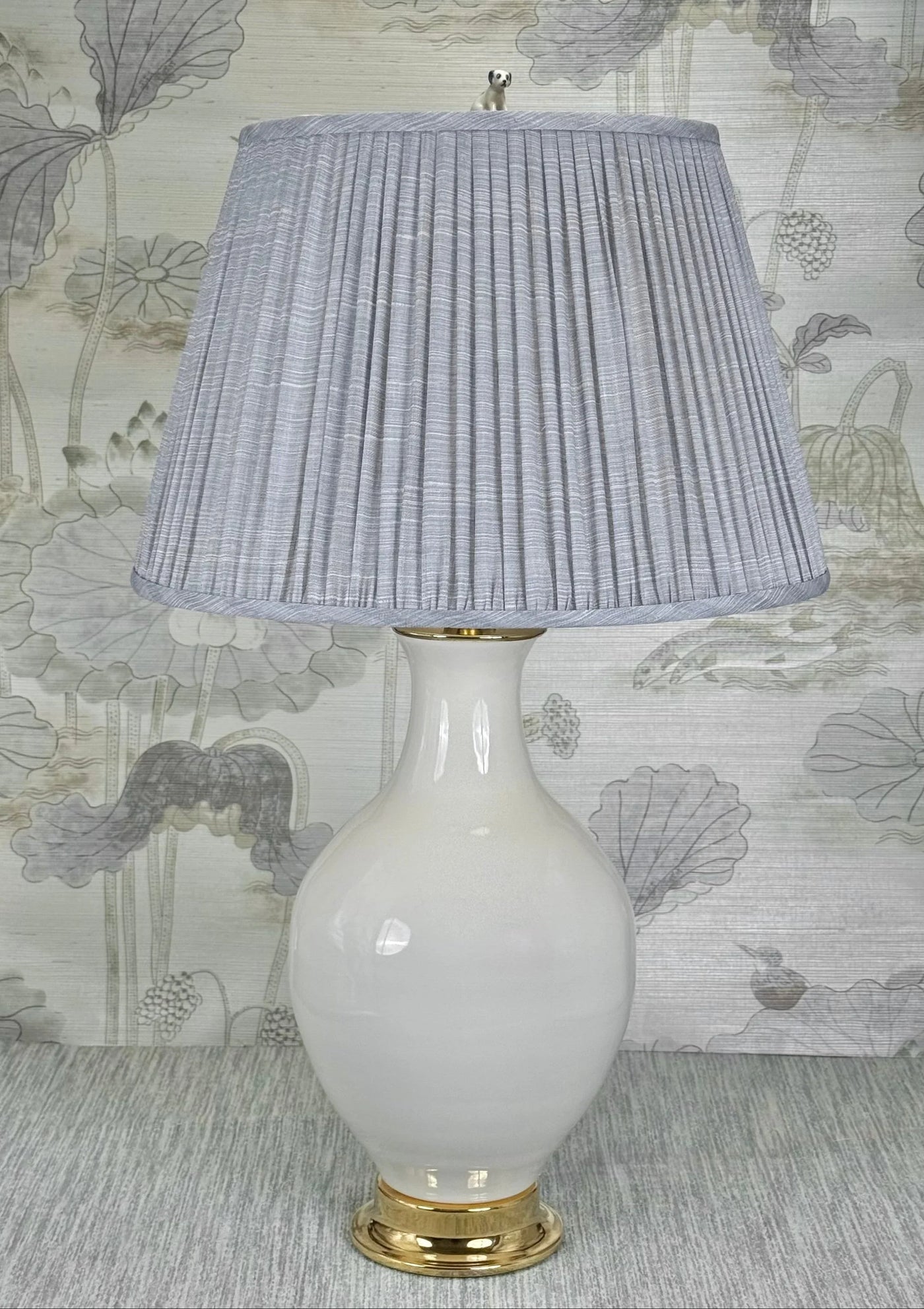 Sitting Puppy lamp finial styled with a Fermoie strie lampshade on a Paul Schneider Athens ceramic lamp