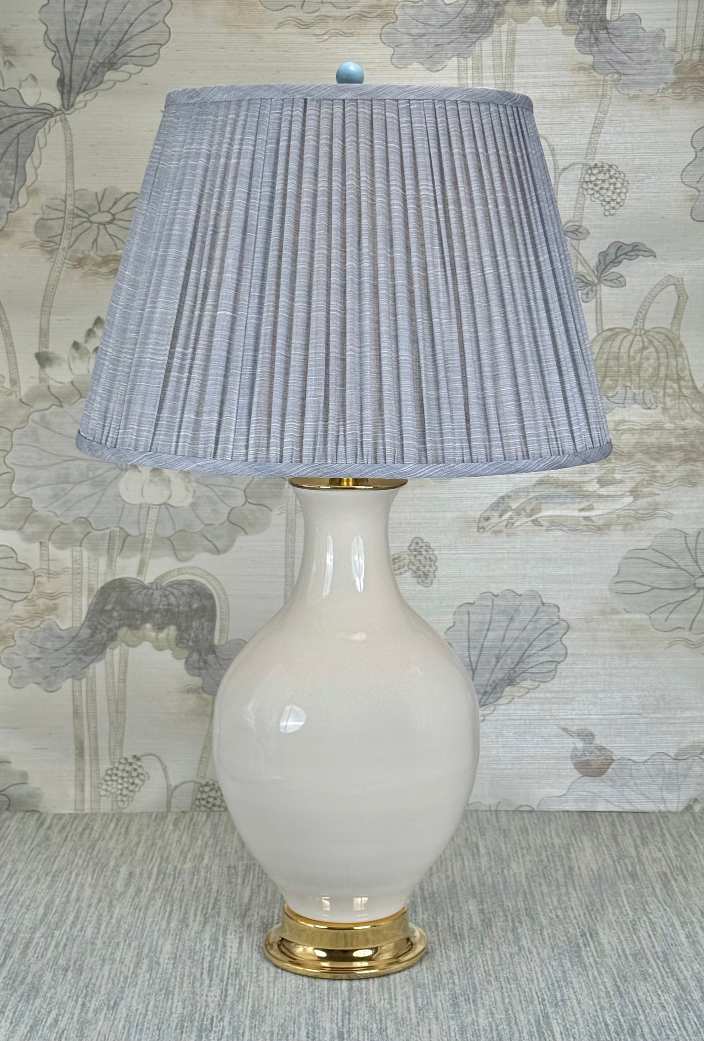 Sky blue lamp finial styled with a Fermoie strie lampshade on a Paul Schneider Athens ceramic lamp.