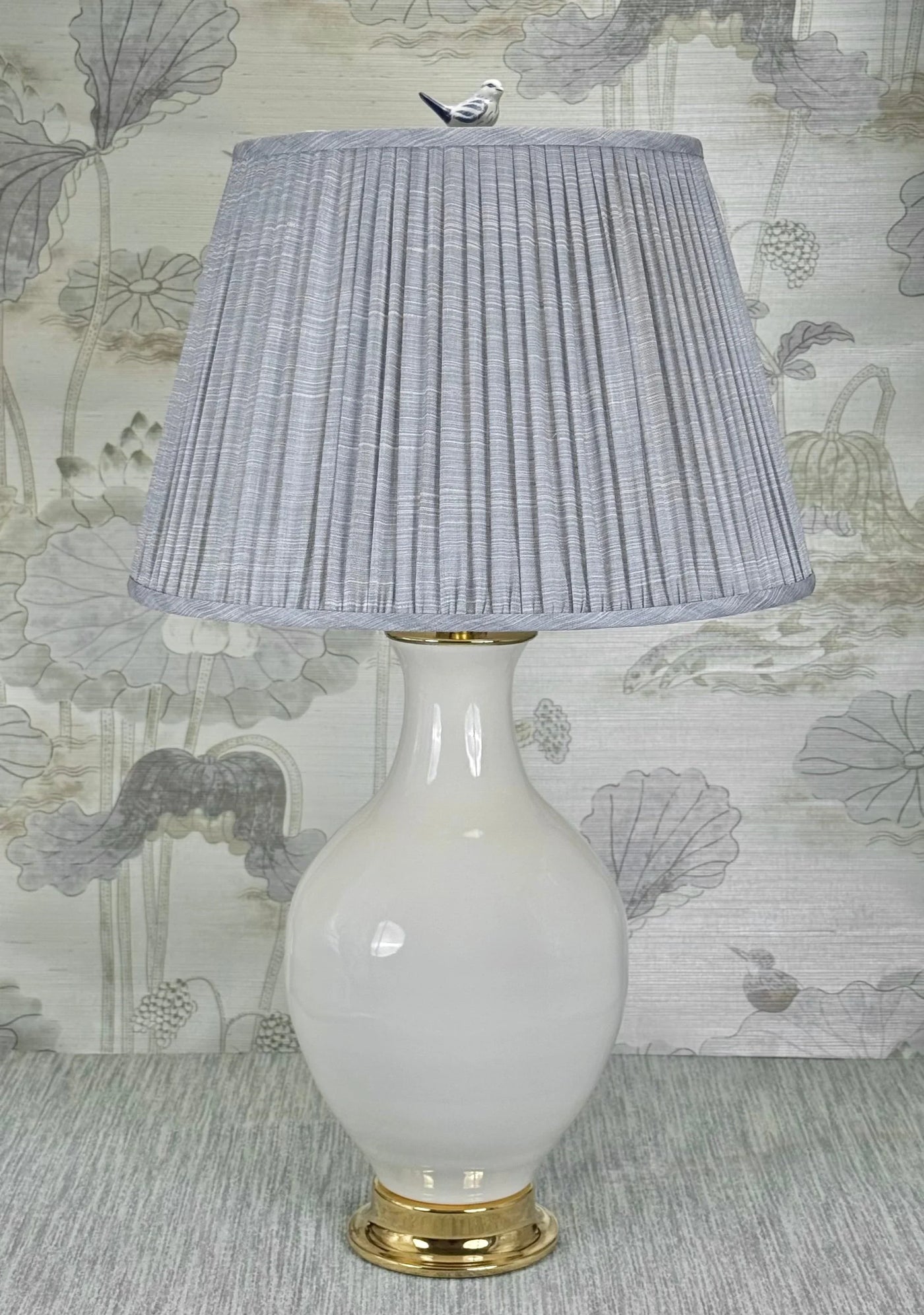 Song Bird lamp finial styled with a Fermoie strie lampshade on a Paul Schneider Athens ceramic lamp.