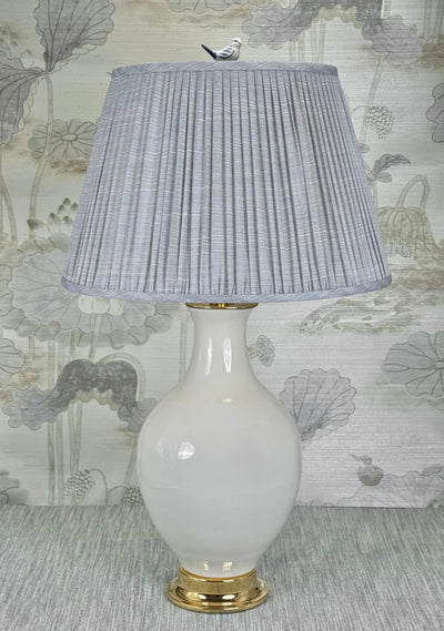 Song Bird lamp finial styled with a Fermoie strie lampshade on a Paul Schneider Athens ceramic lamp.