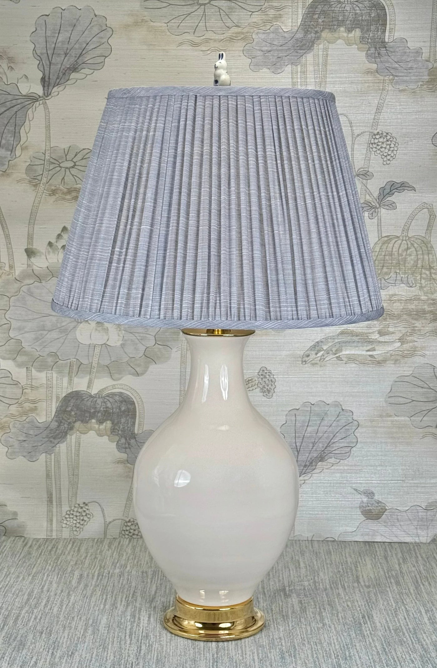Standing Rabbit lamp finial styled with a Fermoie strie lampshade on a Paul Schneider Athens ceramic lamp