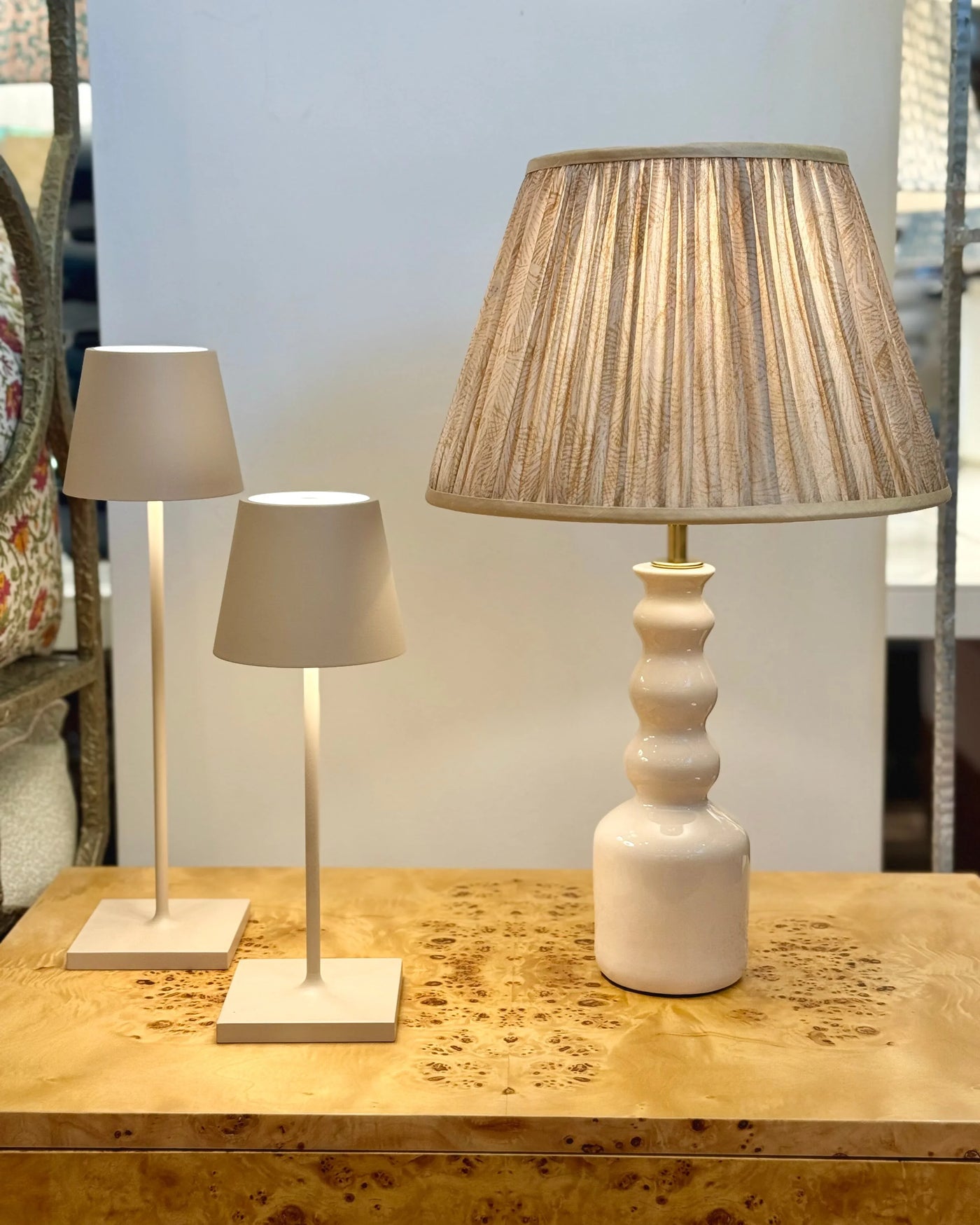 Timmy Ceramic Table Lamp in Cream with cream sari lampshade next to beige poldinas