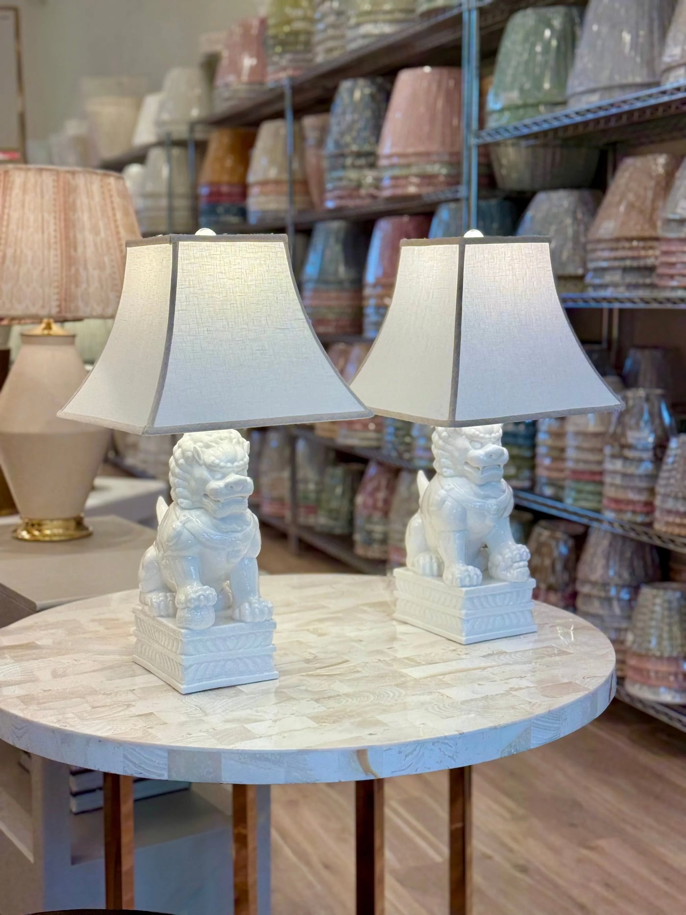White Linen Square Bell Lampshade with Oatmeal Trim paired with Porcelain White Foo Dog Table Lamps