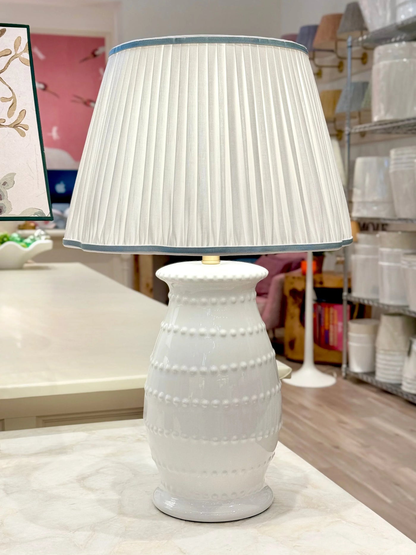 White Pleated Linen Scalloped Lampshade with Light Blue Trim on white spitzy lamp