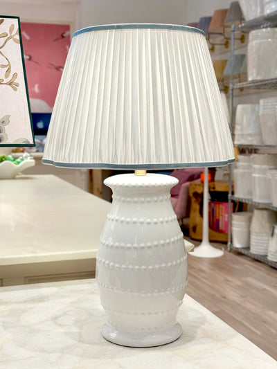 White Pleated Linen Scalloped Lampshade with Light Blue Trim on white spitzy lamp
