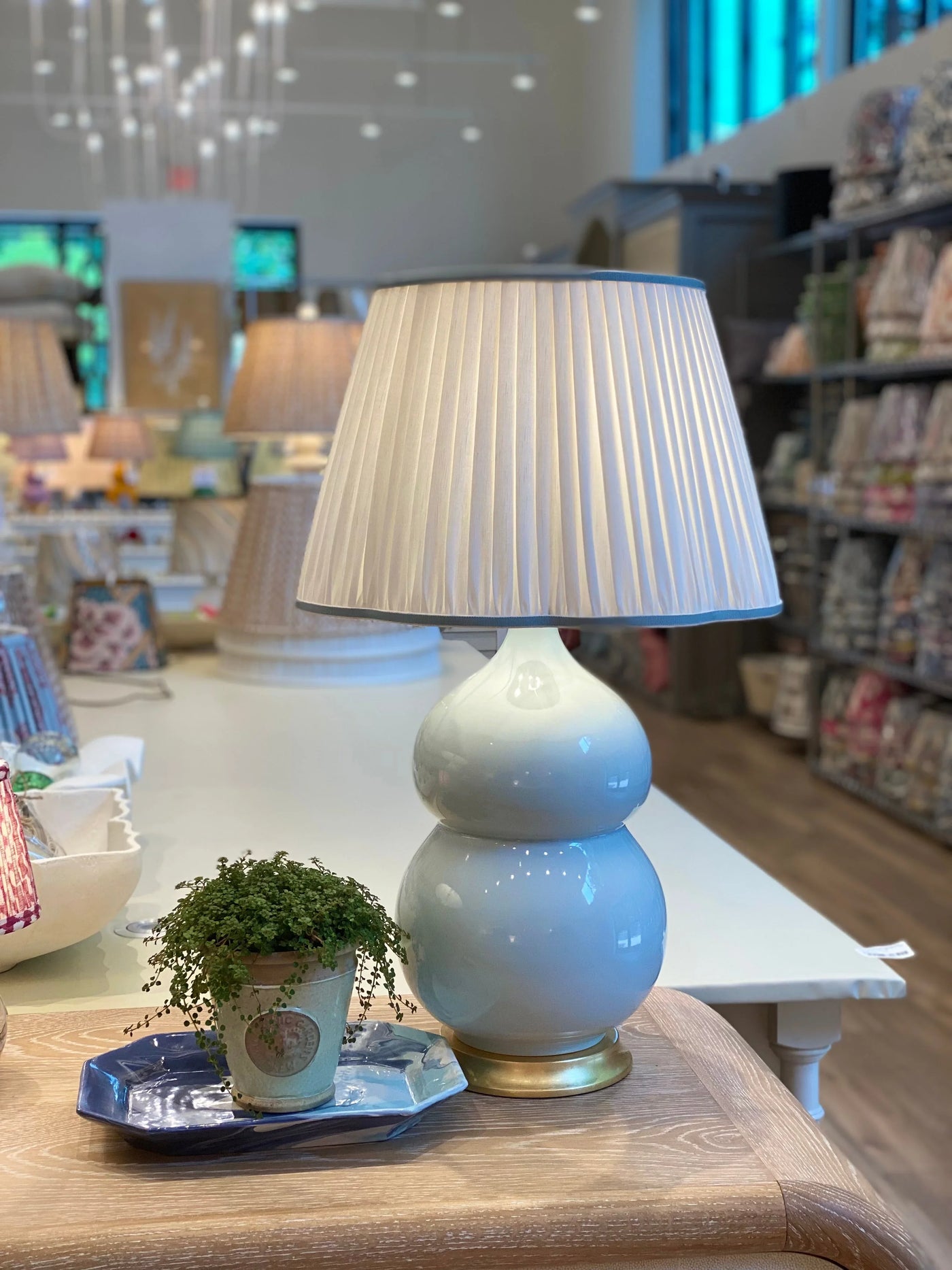 White Pleated Linen Scalloped Lampshade with Light Blue Trim on light blue Nanjing Lamp