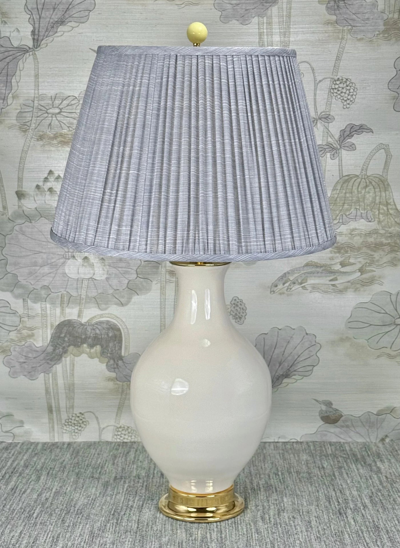 Yellow Ceramic lamp finial styled with a Fermoie strie lampshade on a Paul Schneider Athens ceramic lamp