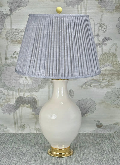 Yellow Ceramic lamp finial styled with a Fermoie strie lampshade on a Paul Schneider Athens ceramic lamp