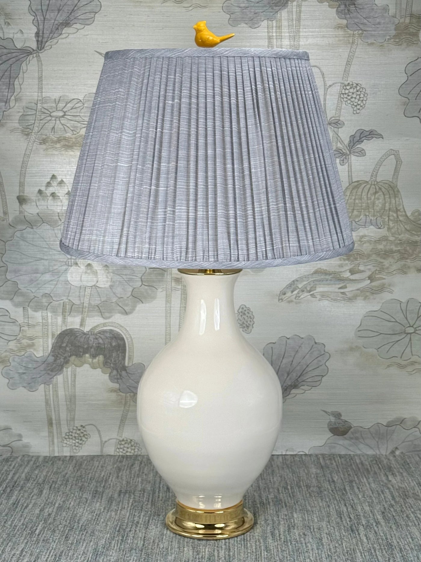 Yellow Porcelain Bird  lamp finial styled with a Fermoie strie lampshade on a Paul Schneider Athens ceramic lamp