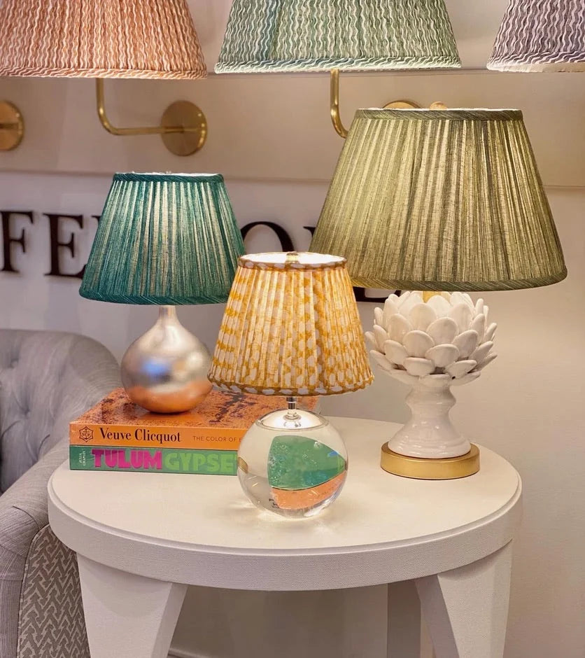 Yellow wicker lampshade on a crystal lamp