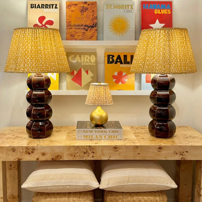 two tortoise barnacle Hwang Bishop lamps with yellow Rabanna Fermoie lampshades vignette 