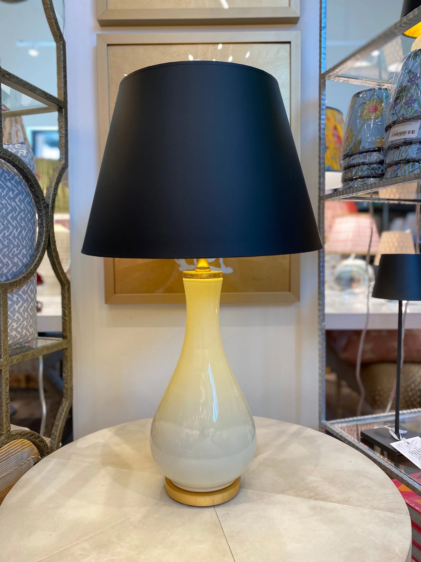 Black empire lamp shade on ivory porcelain lamp