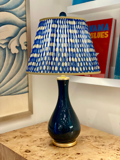 blue and gold block print lampshade on  a navy lamp