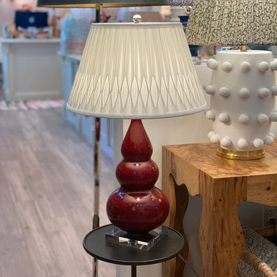 Bottom smocked silk lampshade on a red lamp