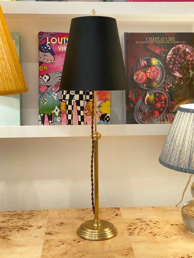 Black deep empire lampshade on a brass lamp