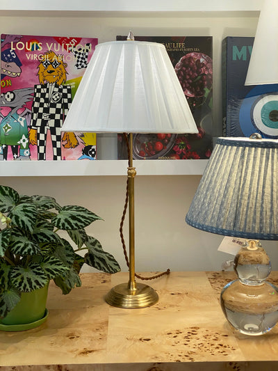 Empire linen wide box pleat lampshade on a brass lamp