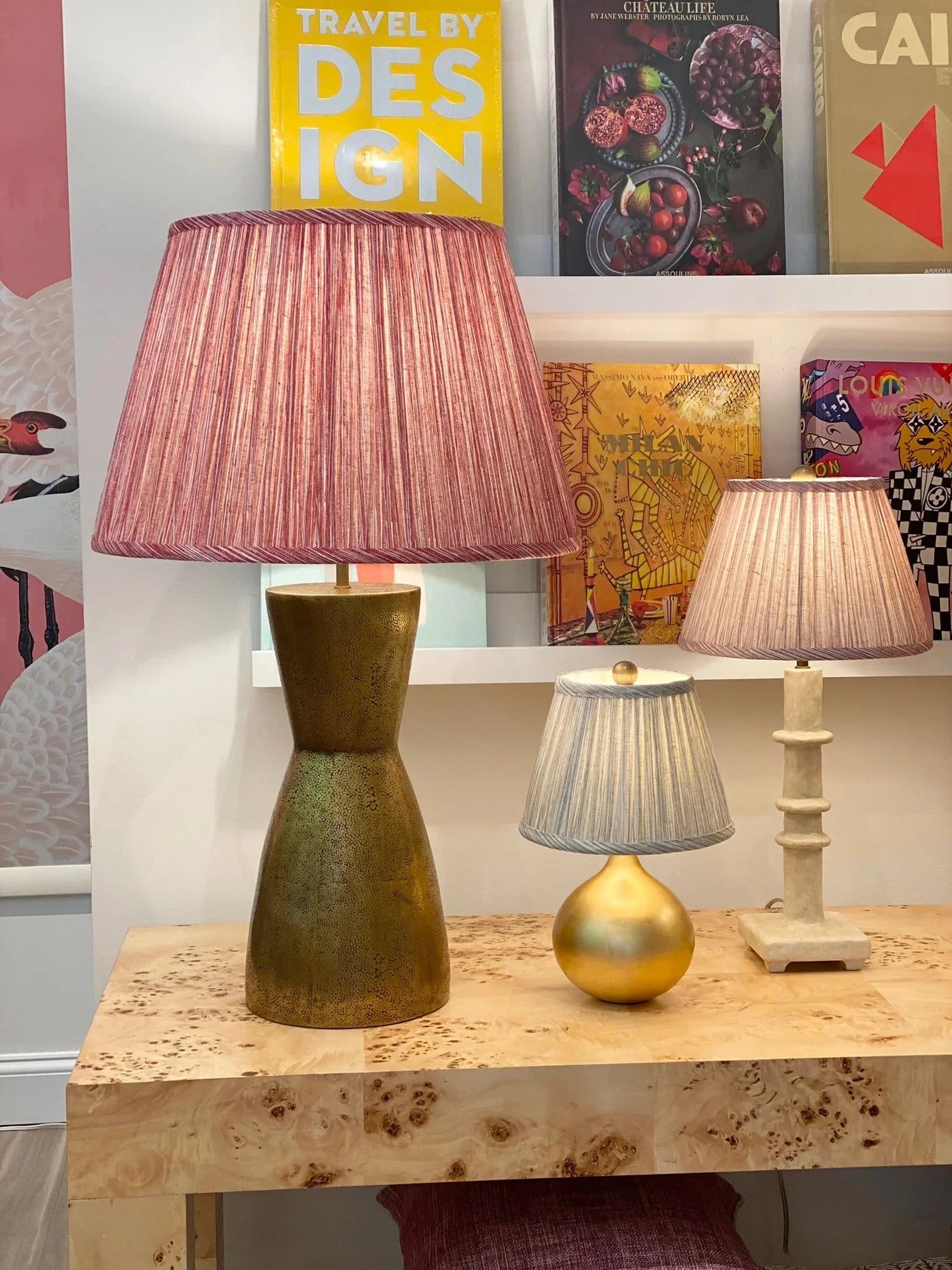 Fermoie red strie lampshade on a brass lamp