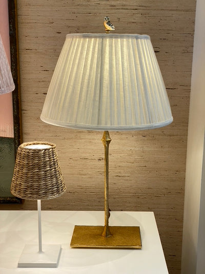 gray owl finial on a brass lamp