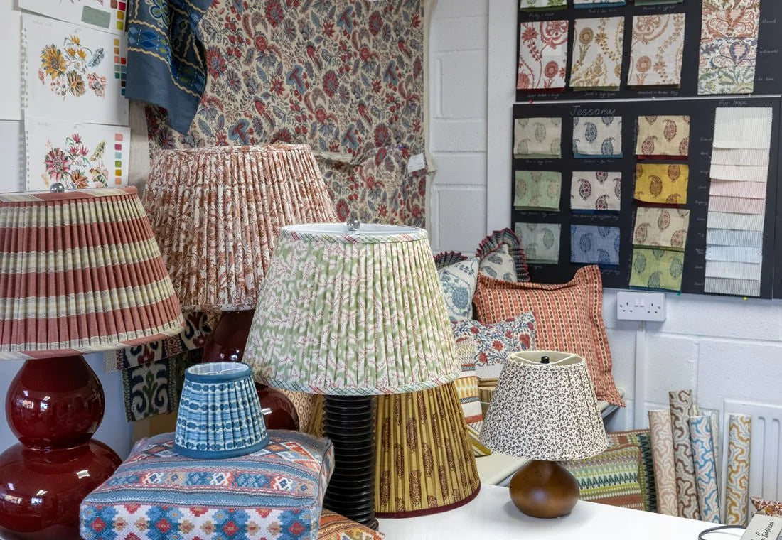 Printed and pleated lampshades with pillows in the Ian Sanderson studio