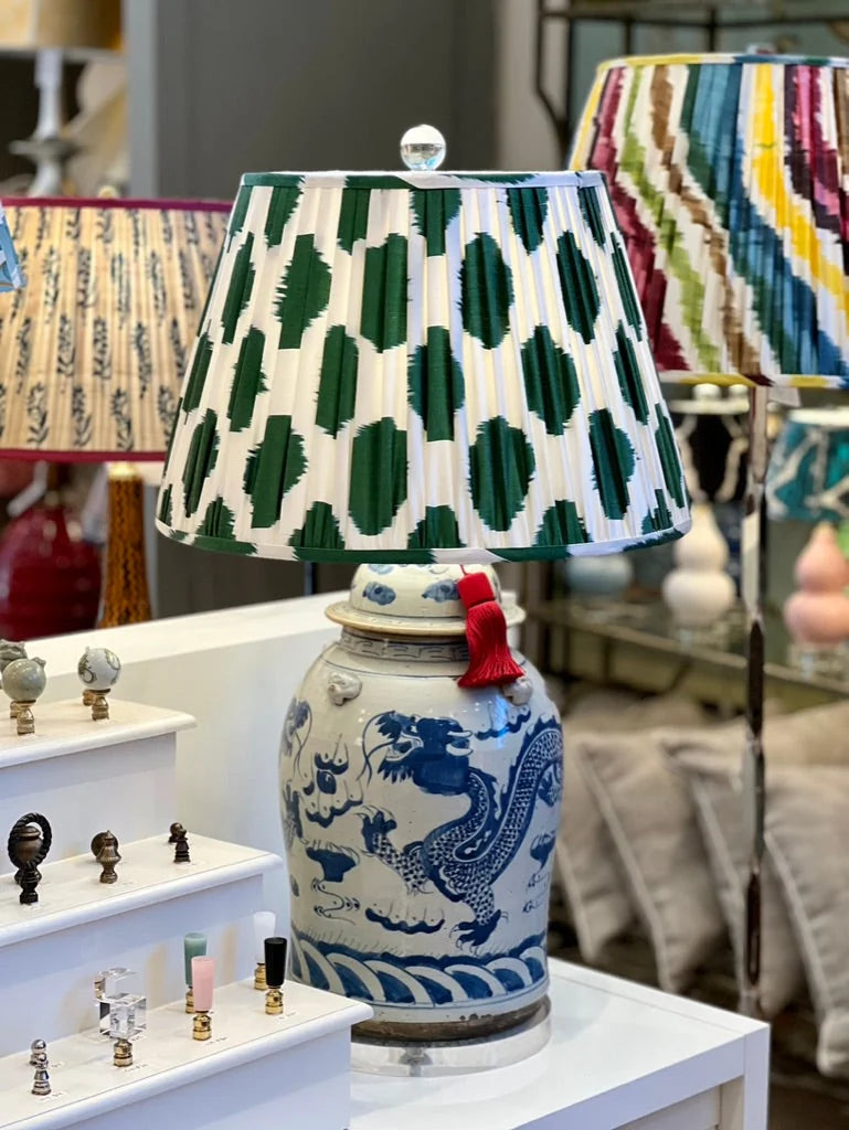 Green and white ikat lampshade on a blue and white lamp