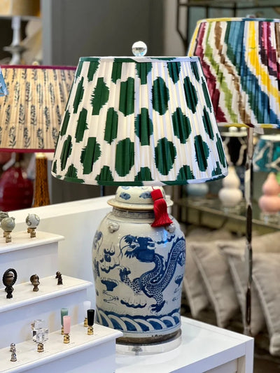 Green and white ikat lampshade on a blue and white lamp