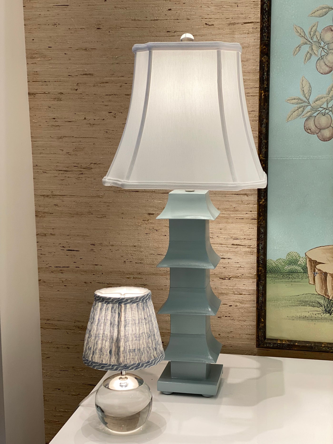 Inverted cut corner lampshade on a blue pagoda lamp and a tiny terri lamp with Fermoie lampshade