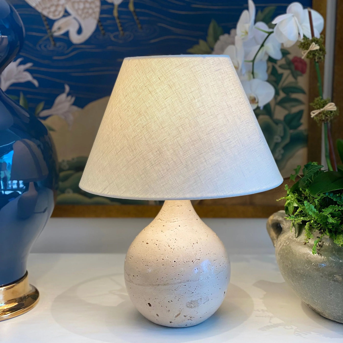 Linen rolled edge modern flare on a travertine lamp