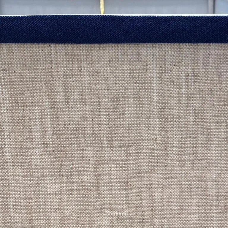 oatmeal linen with navy trim lampshade close up
